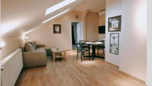 a living room with a couch and a table at Evropa Sombor in Sombor
