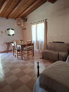 a living room with a table and a couch at Cactus y Almacen - Purmamarca in Purmamarca