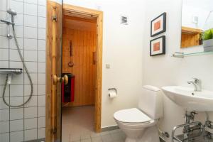 a bathroom with a toilet and a sink at 717-Hvide-Sande-Slusen-17 in Hvide Sande +25 photos