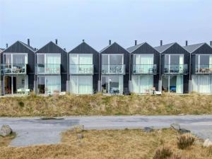 a row of houses on the beach at 717-Hvide-Sande-Slusen-17 in Hvide Sande