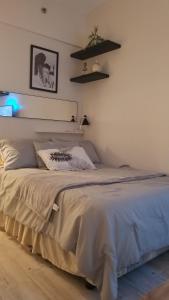 a bedroom with a bed in a room at Sunvida tower Unit 1911 in front Sm Cebu in Cebu City +6 photos