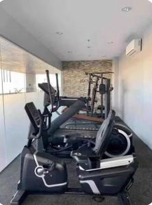 a gym with cardio equipment in a room at Sunvida tower Unit 1911 in front Sm Cebu in Cebu City