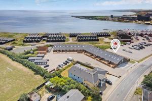 an aerial view of a building with a parking lot at 776-Hvide-Sande-Norregade-2-nr-27 in Hvide Sande