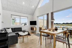 a living room with a couch and a table at 9953-Hvide-Sande-Langsand-212 in Hvide Sande