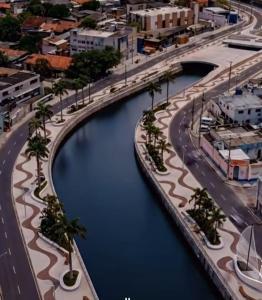 an aerial view of a city with a river at ML Integra Mix kitnets in Maceió