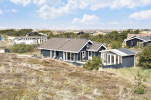 a house sitting on top of a hill at 604-Hvide-Sande-Bjerregardsvej-193 in Bjerregård