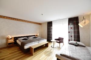 Säng eller sängar i ett rum på Landgasthof Kreuz - Businessaufenthalt mit Wohlfühlgarantie