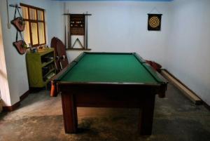 a room with a green pool table in it at JaimeCrazyhostel in Huarmey