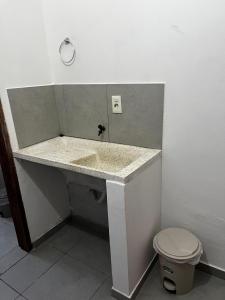 a bathroom with a sink and a toilet at Residencial Lapacho 2 in Luque
