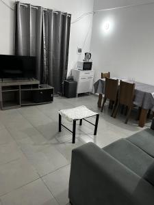 a living room with a couch and a table at Residencial Lapacho 2 in Luque