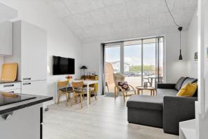 a living room with a couch and a table at 774-Hvide-Sande-Norregade-2-nr-7 in Hvide Sande