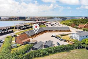 an aerial view of a building with a parking lot at 774-Hvide-Sande-Norregade-2-nr-7 in Hvide Sande