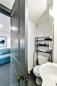 a bathroom with a toilet and a sink at The Montlake Spite House in Seattle +34 photos