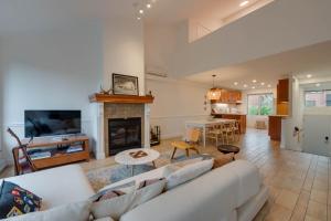 a living room with a couch and a fireplace at Unité 17 - Ski-in Ski-out in Beaupré