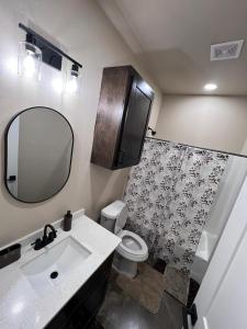 a bathroom with a sink and a toilet and a mirror at Special Deal on Booking Unit 664 in Paris