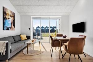 a living room with a couch and a table at 777-Hvide-Sande-Norregade-2-nr-2 in Hvide Sande