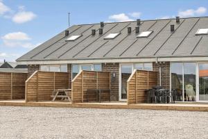 a house with a solarium on the side of it at 781-Hvide-Sande-Norregade-2-nr-9 in Hvide Sande