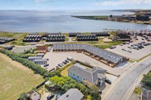 an aerial view of a building with a parking lot at 771-Hvide-Sande-Norregade-2-nr-28 in Hvide Sande