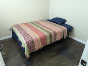 a bed in a room with a colorful blanket on it at Special Deal on 2 Bedroom Unit 556 in Paris