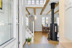 a living room with a wood burning stove in a house at 6005-Stege-Hjelmvej-15 in Stege