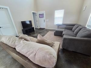 a living room with a couch and a tv at Special Deal on Booking Unit-558 in Paris