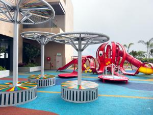 a playground with a bunch of slides and rides at Antara Residence By KLIQ in Genting Highlands