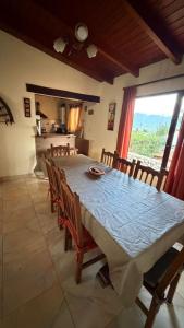 a dining room with a large table and chairs at Casa tafi in Tafí del Valle
