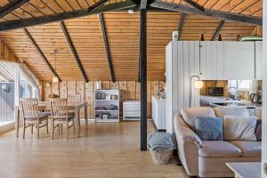 a living room with a couch and a table at 8206-Vordingborg-Havstokken-6 in Vordingborg
