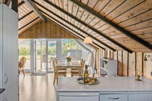 a kitchen and dining room with a table in a house at 8206-Vordingborg-Havstokken-6 in Vordingborg