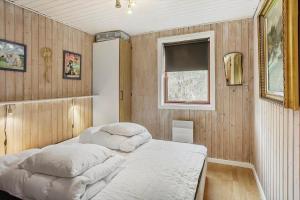 a bedroom with two beds and a window at 5015-Askeby-Gormsvej-5 in Askeby
