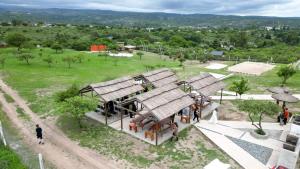an overhead view of a house with thatched roofs at Complejo Gran Chacha in Tanti