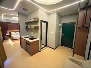 a bathroom with a sink and a mirror at Seeds Hotel Damansara Pelangi in Petaling Jaya
