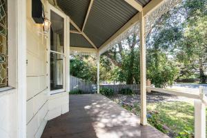 a front porch of a house with a roof at Perfect Point Lonsdale Cottage in Point Lonsdale
