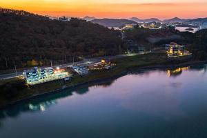 an aerial view of a river at sunset at Yeosu K-Park Spa Pension in Yeosu