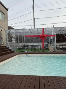 a swimming pool with a tent and a table at Dohwa Pension Cheongju in Cheongju
