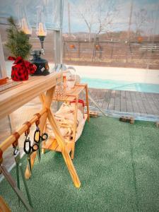 a room with a table with scissors on the floor at Dohwa Pension Cheongju in Cheongju