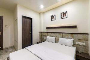 Postel nebo postele na pokoji v ubytování Hotel City Inn