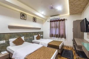 Postel nebo postele na pokoji v ubytování Hotel City Inn