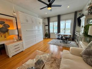 a living room with a couch and a table in it at The Riviera in San Pedro