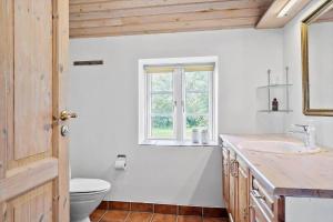 a bathroom with a sink and a toilet and a window at 369-Lemvig-Klostervej-39 in Lemvig +31 photos
