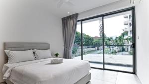 a bedroom with a large bed and a large window at Modern Luxury Villa Hinai by Simple Sanctuary in George Town +46 photos