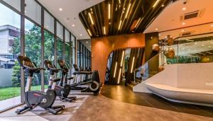 a gym with cardio equipment in a building at Modern Luxury Villa Hinai by Simple Sanctuary in George Town