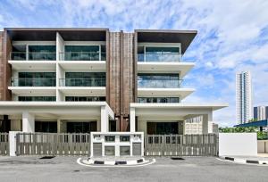 a building with a white fence in front of it at Modern Luxury Villa Hinai by Simple Sanctuary in George Town