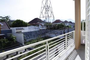 a balcony with a view of a city at linns house borobudur syariah malang in Blimbing