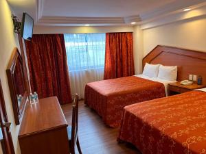 เตียงในห้องที่ Hotel Premier +27 ภาพ