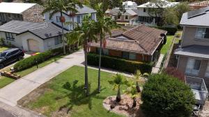 an aerial view of a house with palm trees at Mistral Breeze in Nelson Bay