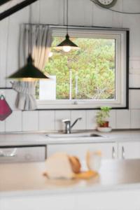 a kitchen counter with a sink and a window at 2555-Romo-A-M-Listsvej-6 in Høm +37 photos