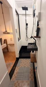 a room with a sink on the wall and a room with at New studio General Luna in General Luna