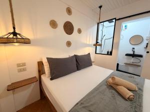 a bedroom with a bed in a room at New studio General Luna in General Luna