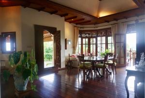 a dining room with a table and chairs at Gunung Paradis Retreat in Munduk